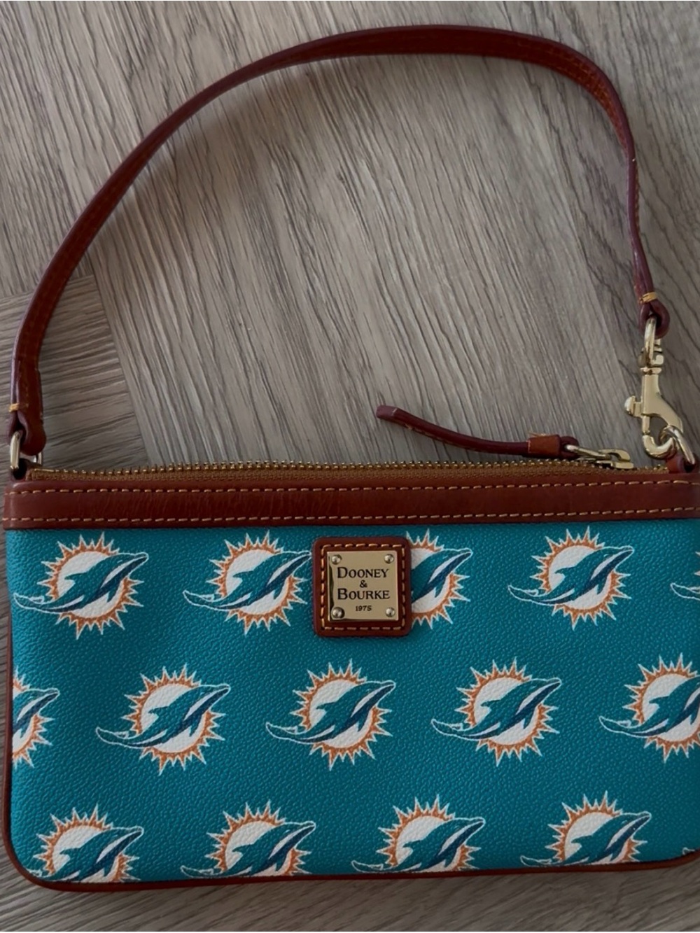 Like New Dooney & Bourke Teal Miami Dolphins Logo Wristlet with Brown Trim